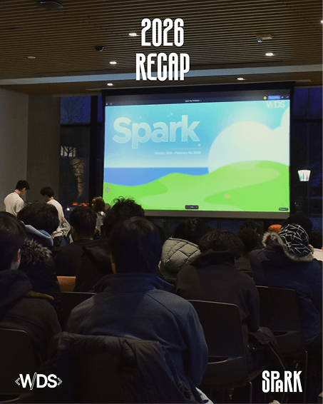 Audience watching a Spark 2026 recap presentation